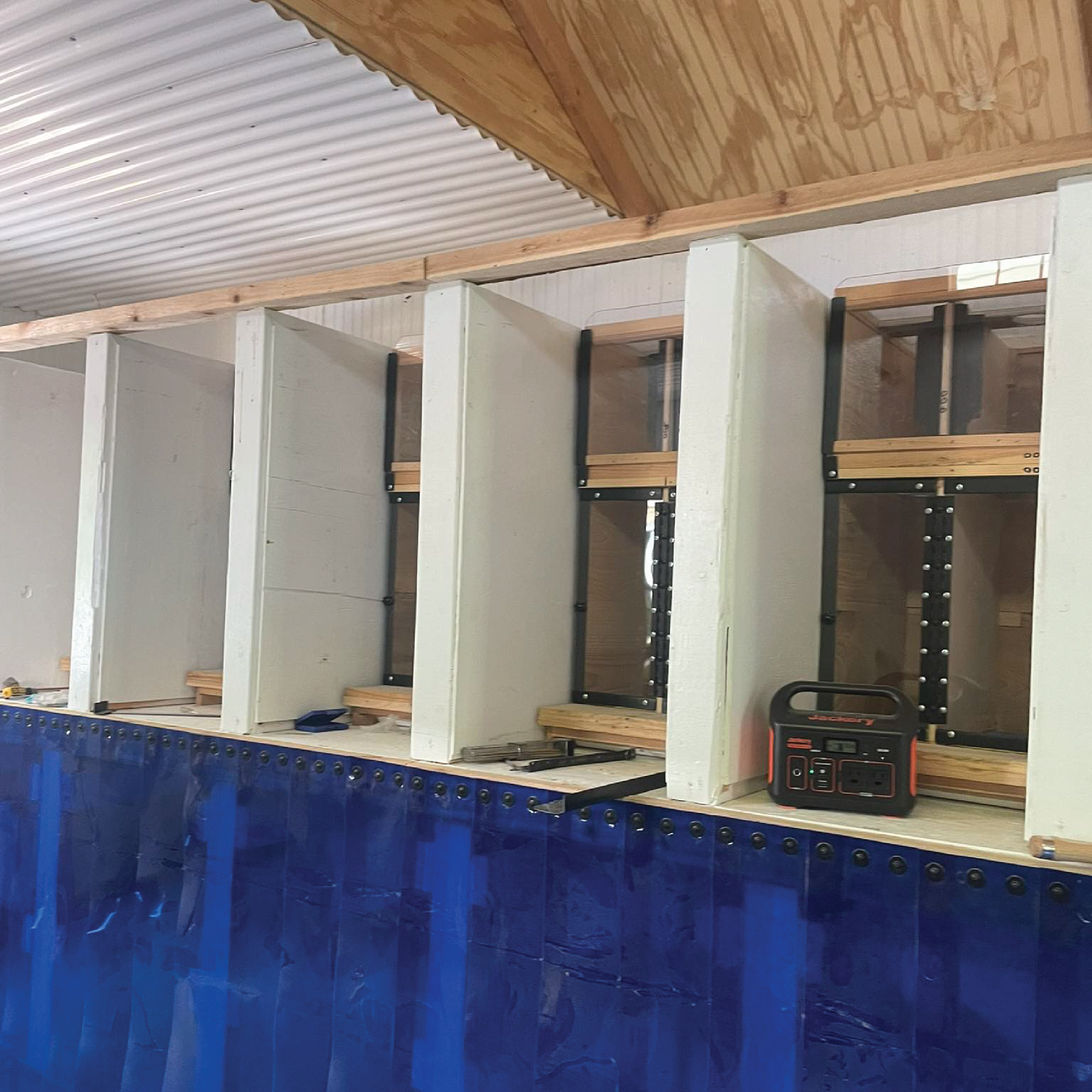 inside the bee house with hives under construction